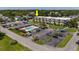 An aerial view of condos showing its inviting pool, ample parking, and well-maintained landscaping at 405 21St Ave. S # 1-O, North Myrtle Beach, SC 29582