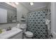 Full bathroom with vanity, toilet, mirror and green patterned shower curtain at 405 21St Ave. S # 1-O, North Myrtle Beach, SC 29582