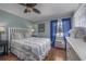 Nicely furnished bedroom with wood floors and a large window providing natural light at 405 21St Ave. S # 1-O, North Myrtle Beach, SC 29582