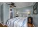 Charming bedroom with wood floors and furnishings, leading to a full ensuite bathroom at 405 21St Ave. S # 1-O, North Myrtle Beach, SC 29582