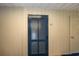 Blue louvered front door with unit number and sidelight at 405 21St Ave. S # 1-O, North Myrtle Beach, SC 29582