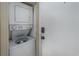 Laundry area with stacked white washer and dryer at 405 21St Ave. S # 1-O, North Myrtle Beach, SC 29582
