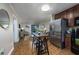 Cozy condo living area features an open floorplan, wood floors, and a sliding glass door to the outside at 405 21St Ave. S # 1-O, North Myrtle Beach, SC 29582