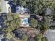 This aerial view shows the property's location near a parking lot, houses, foliage, driveways and neighborhood at 413 30Th Ave. N, Myrtle Beach, SC 29577