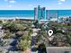 Enjoy this aerial view of the property near the beach, hotel and the shops and businesses along the main throughfare at 413 30Th Ave. N, Myrtle Beach, SC 29577