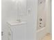 Clean, all-white bathroom with a vanity, mirror, and shower-tub combination, ready for customization at 413 30Th Ave. N, Myrtle Beach, SC 29577