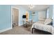 Light-filled bedroom with light blue walls, closet and open access to kitchen enhances space for versatility at 413 30Th Ave. N, Myrtle Beach, SC 29577