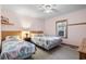 Cozy bedroom with two beds, soft lighting, and a window with decorative curtains at 413 30Th Ave. N, Myrtle Beach, SC 29577
