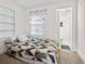 Cozy bedroom features a comfortable bed, built-in shelving, and en-suite bathroom, creating a private retreat at 413 30Th Ave. N, Myrtle Beach, SC 29577