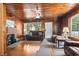 Spacious living room with wood paneling, fireplace, and comfortable seating at 413 30Th Ave. N, Myrtle Beach, SC 29577