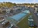 Aerial view of community amenities including a pool and tennis court with adjacent parking at 4222 Pinehurst Dr. # I-9, Little River, SC 29566