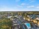 A picturesque aerial view of the community with a lake and inviting swimming pool at 4222 Pinehurst Dr. # I-9, Little River, SC 29566