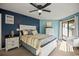 Comfortable bedroom featuring stylish furniture, a ceiling fan, and access to the outdoor porch at 4222 Pinehurst Dr. # I-9, Little River, SC 29566