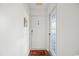 Bright entryway features a welcome mat, charming decor, and a secure door with nearby exit, enhancing a warm ambiance at 4222 Pinehurst Dr. # I-9, Little River, SC 29566