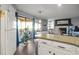 Bright kitchen featuring a breakfast bar that opens to a comfortable living area and outdoor patio at 4222 Pinehurst Dr. # I-9, Little River, SC 29566