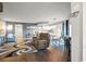 Open-concept living area boasts modern furnishings, wood floors, and a seamless flow into the adjacent kitchen at 4222 Pinehurst Dr. # I-9, Little River, SC 29566