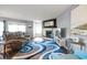 Spacious living room boasting an inviting fireplace, comfortable seating, and ample natural light for a warm and welcoming ambiance at 4222 Pinehurst Dr. # I-9, Little River, SC 29566