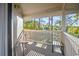 Relaxing outdoor porch with wooden railings and views of the surrounding greenery at 4222 Pinehurst Dr. # I-9, Little River, SC 29566