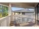 Private outdoor porch with views of the adjacent building and the surrounding trees at 4222 Pinehurst Dr. # I-9, Little River, SC 29566