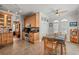 Bright dining area featuring hardwood cabinets, with a view to an adjacent kitchen at 4306 Windy Heights Dr., North Myrtle Beach, SC 29582