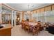 Inviting dining room featuring tile floors, a chandelier, and natural light from large windows at 4306 Windy Heights Dr., North Myrtle Beach, SC 29582