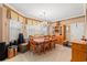 This spacious dining room has a chandelier, built-in shelving, and a large window for natural light at 4306 Windy Heights Dr., North Myrtle Beach, SC 29582
