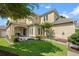 Inviting two-story home with manicured lawn, mature trees, and charming front porch at 4306 Windy Heights Dr., North Myrtle Beach, SC 29582
