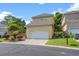 Charming two-story home with attached garage, manicured shrubs, and tasteful landscaping at 4306 Windy Heights Dr., North Myrtle Beach, SC 29582