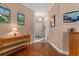Traditional home foyer with hardwood floors, decorative lighting, and coastal-themed artwork at 4306 Windy Heights Dr., North Myrtle Beach, SC 29582