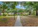 Community gazebo nestled among landscaped grounds, shaded by mature trees at 4306 Windy Heights Dr., North Myrtle Beach, SC 29582
