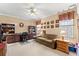 Comfortable living room with neutral paint, a ceiling fan, a sofa, and natural light from windows at 4306 Windy Heights Dr., North Myrtle Beach, SC 29582