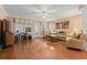Bright living room with hardwood floors, ceiling fan and sliding glass door to the back yard at 4306 Windy Heights Dr., North Myrtle Beach, SC 29582