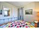 Bedroom featuring a colorful quilt, iron frame bed, and a mirrored closet at 4717 Cobblestone Ln. # B3, Myrtle Beach, SC 29577