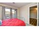 This bedroom has carpet, an iron bed frame, and views to an outdoor porch at 4717 Cobblestone Ln. # B3, Myrtle Beach, SC 29577