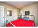 This bedroom has carpet, an iron bed frame, and access to a mirror and closet at 4717 Cobblestone Ln. # B3, Myrtle Beach, SC 29577