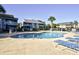Community pool with lounge chairs and nearby buildings under a sunny sky at 4717 Cobblestone Ln. # B3, Myrtle Beach, SC 29577