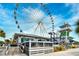 Ferris wheel with dining and amusements underneath and a bright sunny sky overhead at 4717 Cobblestone Ln. # B3, Myrtle Beach, SC 29577