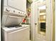 Convenient stackable washer and dryer unit with door reflecting the bathroom at 4717 Cobblestone Ln. # B3, Myrtle Beach, SC 29577
