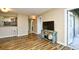 Comfortable living room featuring wood-look flooring, and an open layout at 4717 Cobblestone Ln. # B3, Myrtle Beach, SC 29577