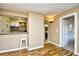 Open-concept living space featuring updated flooring and a view into the kitchen area at 4717 Cobblestone Ln. # B3, Myrtle Beach, SC 29577