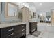 Bright bathroom with double vanity, framed mirrors, and a luxurious soaking tub, providing a spa-like experience at 4856 Bermuda Way N, Myrtle Beach, SC 29577