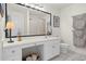 Bright bathroom with a large mirror, vanity, and neutral decor, providing a clean and functional space at 4856 Bermuda Way N, Myrtle Beach, SC 29577
