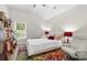 Cozy bedroom featuring a comfortable bed, colorful rug, and natural light, creating a warm and inviting space at 4856 Bermuda Way N, Myrtle Beach, SC 29577