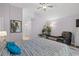 Bright bedroom with a comfortable chair, hardwood floors, and ensuite bathroom, creating a relaxing personal space at 4856 Bermuda Way N, Myrtle Beach, SC 29577