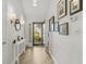 Inviting entryway with views through the front door to a landscaped yard and attractive decor at 4856 Bermuda Way N, Myrtle Beach, SC 29577