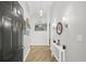 Bright foyer with wood floors, white console table with decor, leading to an open-concept living space at 4856 Bermuda Way N, Myrtle Beach, SC 29577