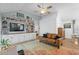 Cozy living room with built-in shelves, large TV and comfortable seating arrangements at 4856 Bermuda Way N, Myrtle Beach, SC 29577