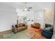 Open-concept living room with vaulted ceiling, brick fireplace, and comfortable seating area at 4856 Bermuda Way N, Myrtle Beach, SC 29577