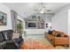 Bright living area featuring a flat screen television, fireplace, and sliding glass doors at 4856 Bermuda Way N, Myrtle Beach, SC 29577