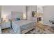 Inviting main bedroom with decorative headboard, bedside tables, and ensuite bathroom, offering a peaceful retreat at 4856 Bermuda Way N, Myrtle Beach, SC 29577